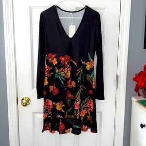 Black long sleeve dress with floral ruffle bottom